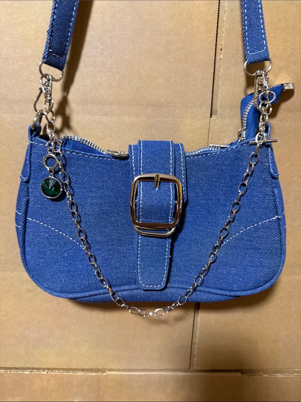 Blue Denim bag with Chain-Accent with a green jewel. Bag not for sale